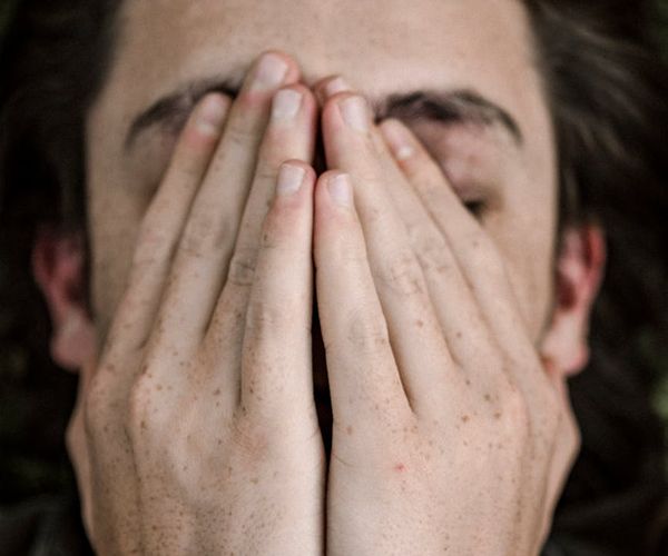 Close-up of a person breathing deeply with calm expression.